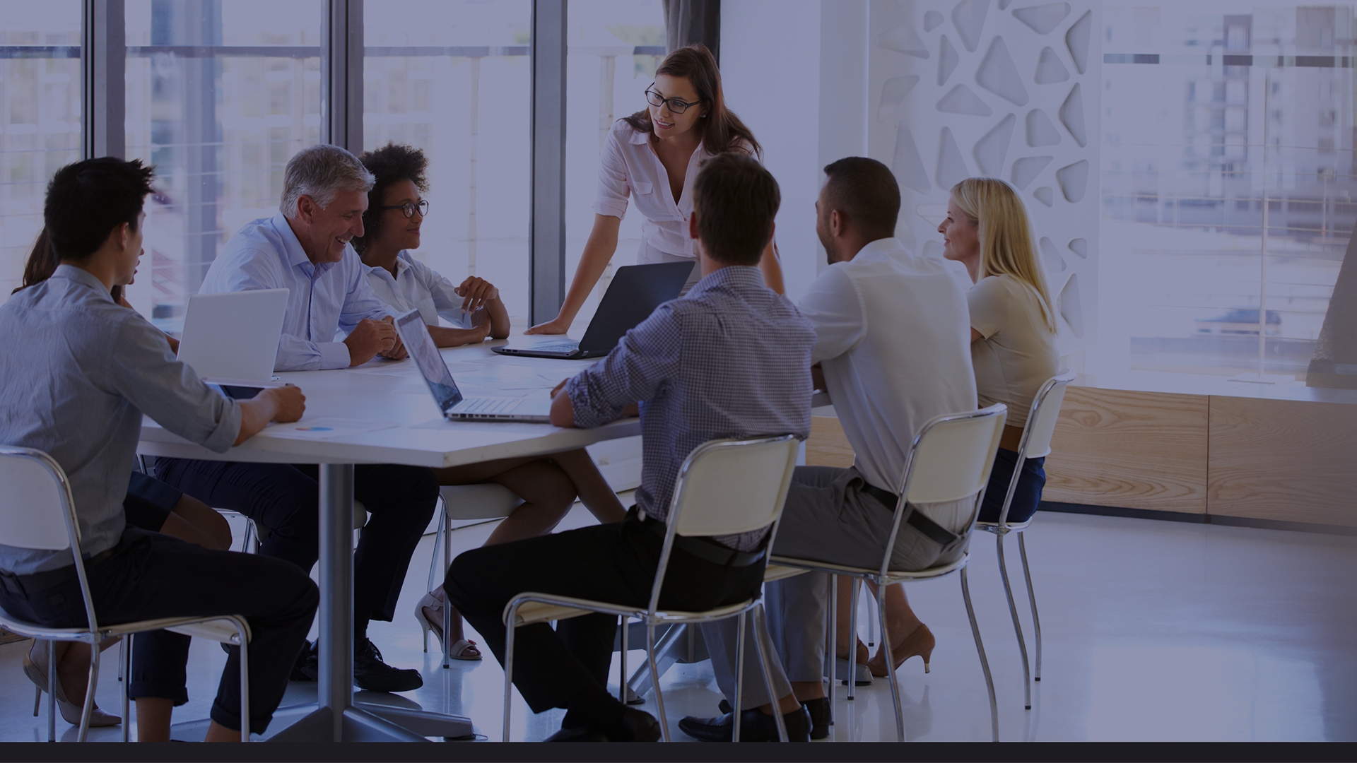 Businesswoman presenting to colleagues at a meeting